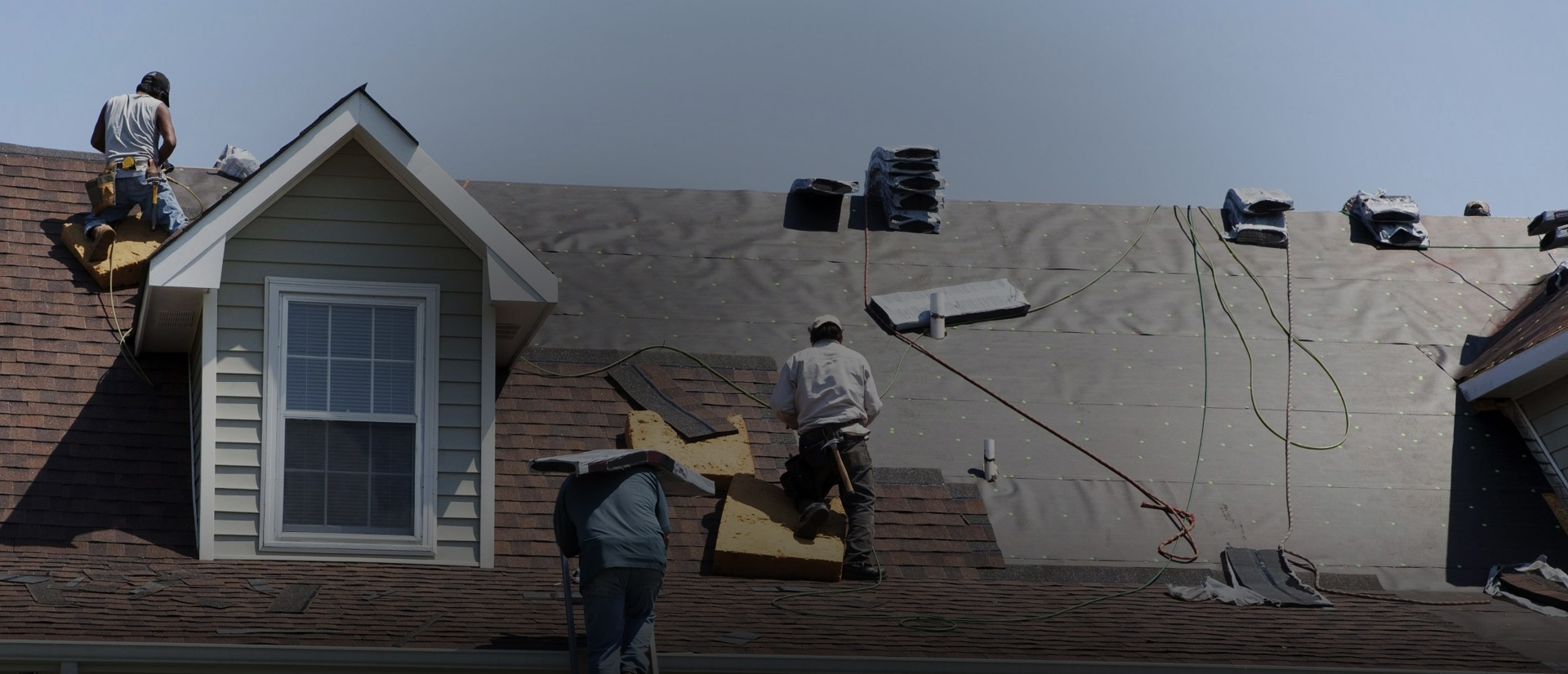 Roofing crew at work on a home